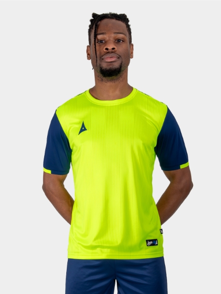 Model wearing a bright yellow Football Top with Navy Sleeves