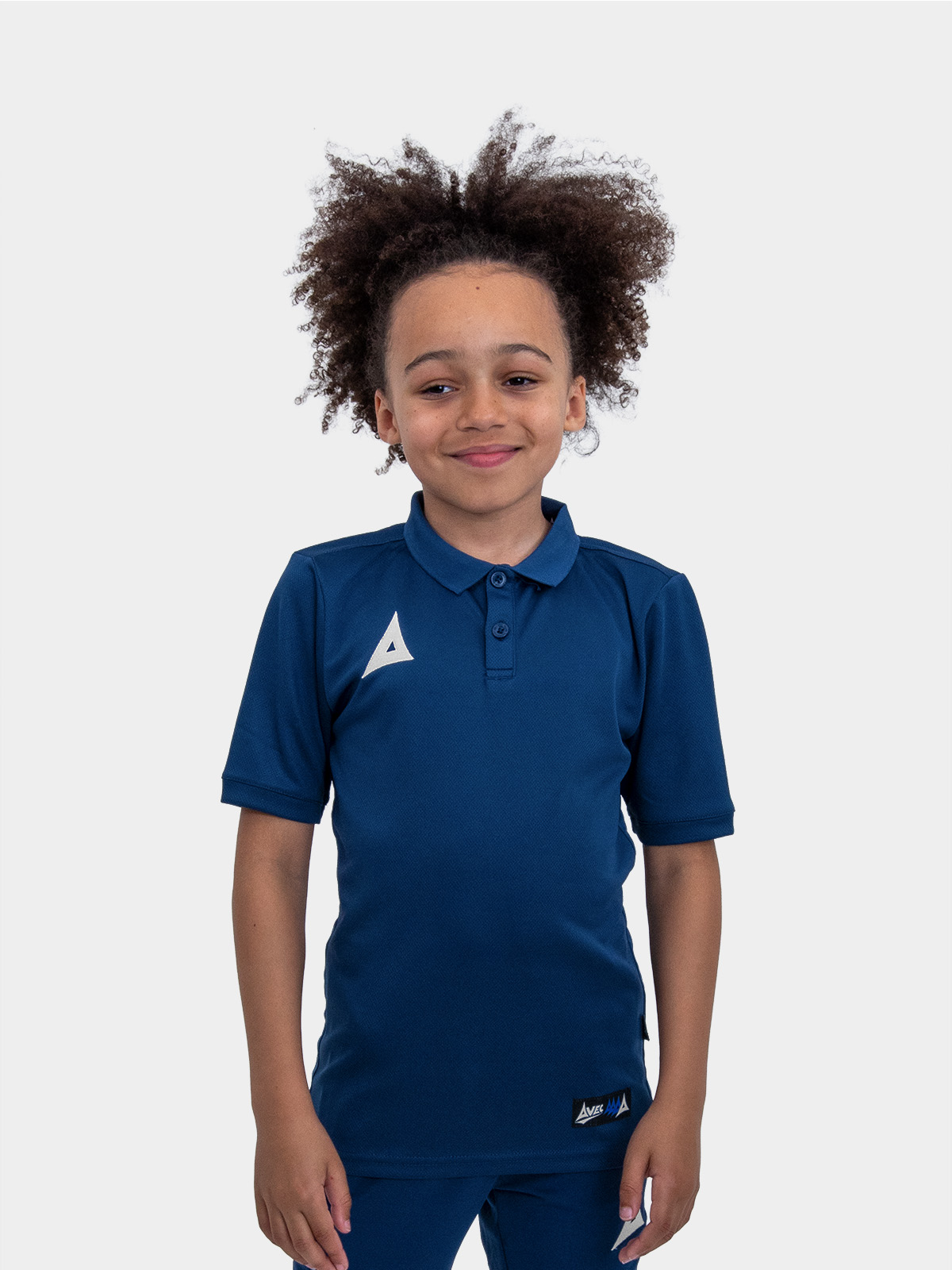 a boy is wearing the avec focus 2 navy tech polo 