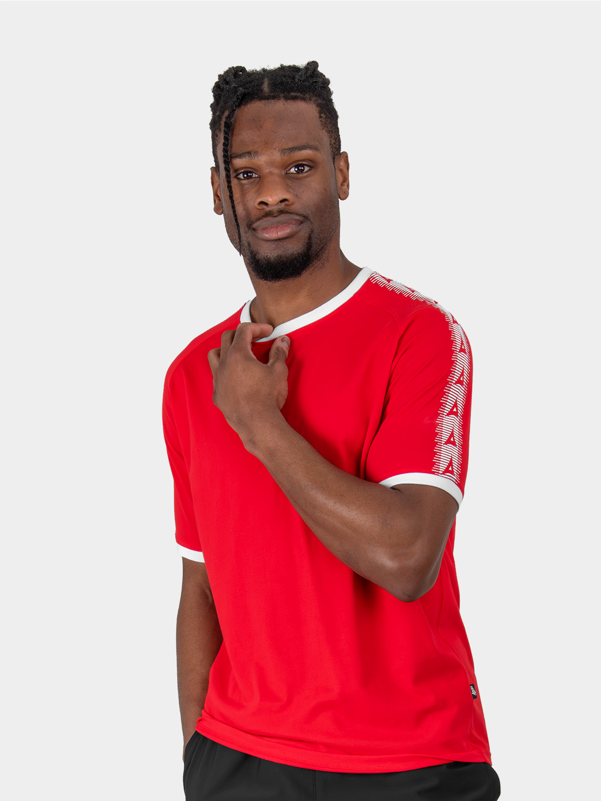	a male model wearing the avec evolve red t-shirt, plain red top with ribbed sleeve cuff and neck