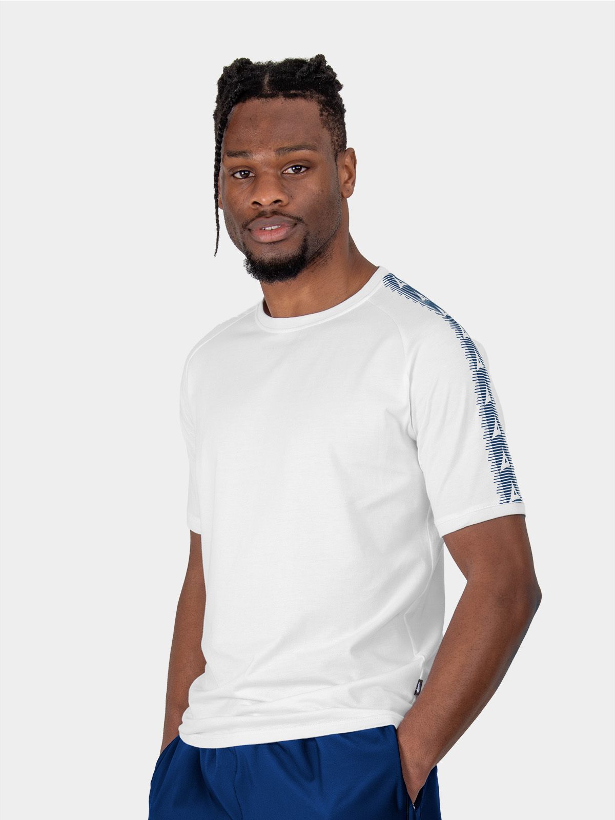 	a male model wearing the avec evolve white t-shirt, plain cotton top with ribbed sleeve cuff and neck
