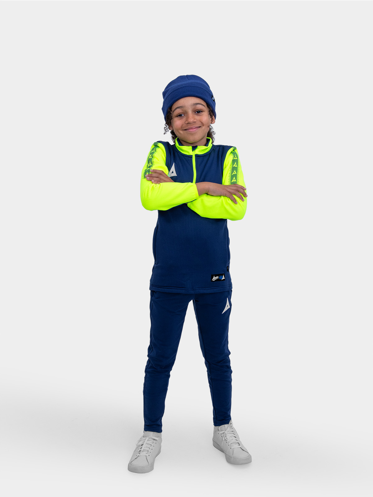 	a boy wearing a navy turn up beanie and a navy and neon yellow overlay