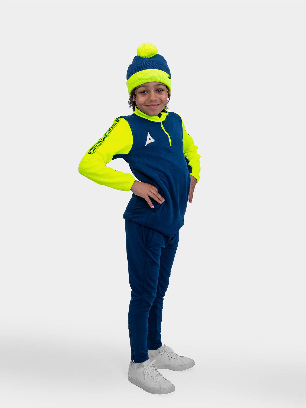 	this child is wearing a junior bobble hat in navy and yellow, which can be worn as part of our pro player colleciton.