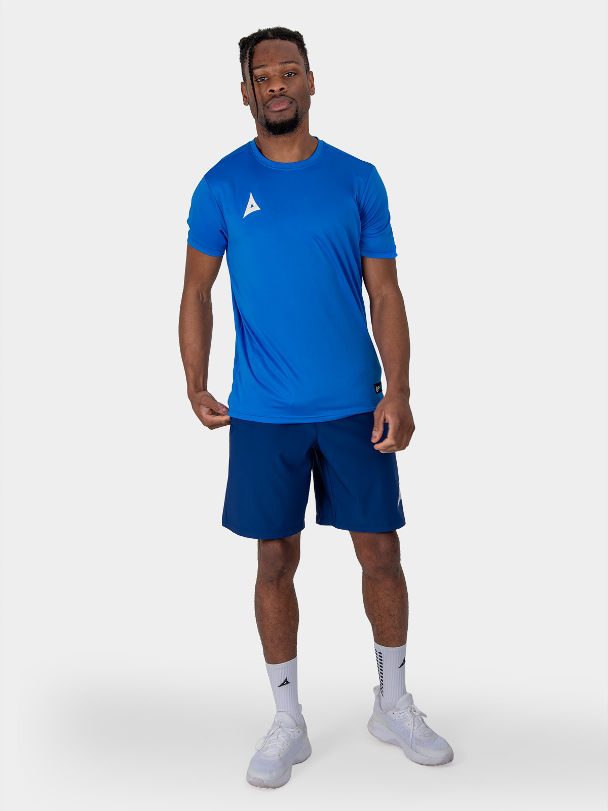 	this man is wearing the focus classic navy blue tech shorts, which are ideal for training.
