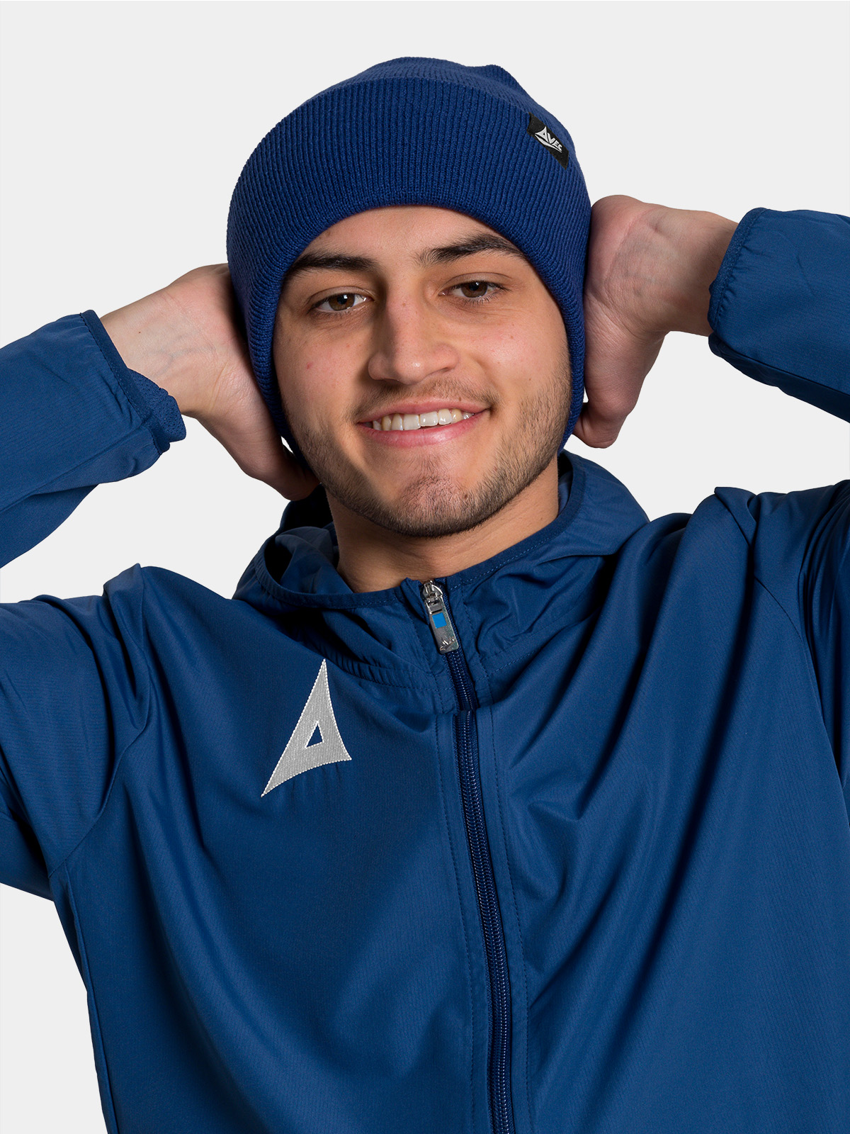 model wearing navy avec sport beanie hat for cold-weather training