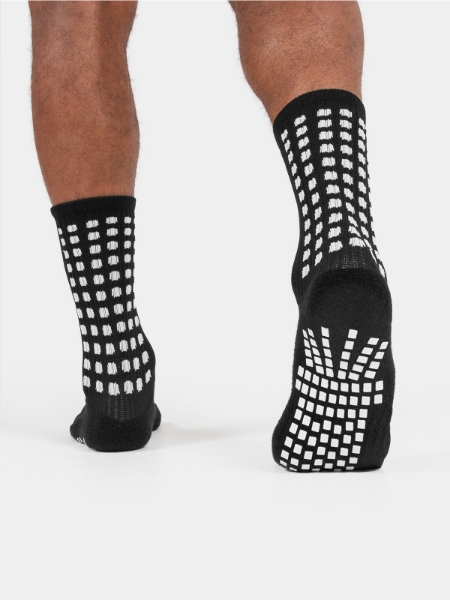 Breathable cushioned anti‑slip football socks designed for stability and comfort