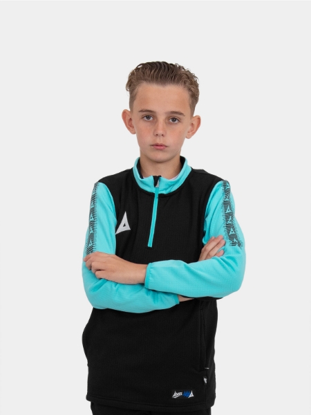 A young child is wearing a black quarter-zip jumper with light blue sleeves