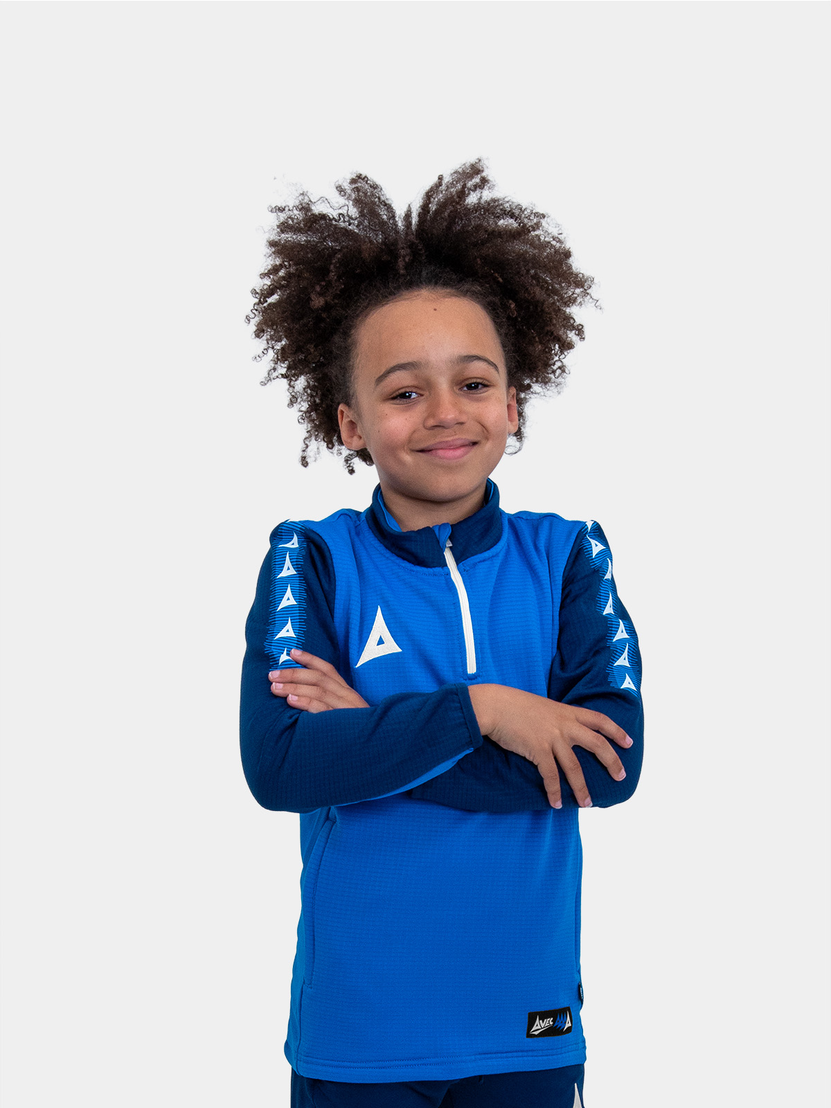 	with his arms folded, this young boy is wearing a soft and comfortable royal blue and navy jumper with a zip.