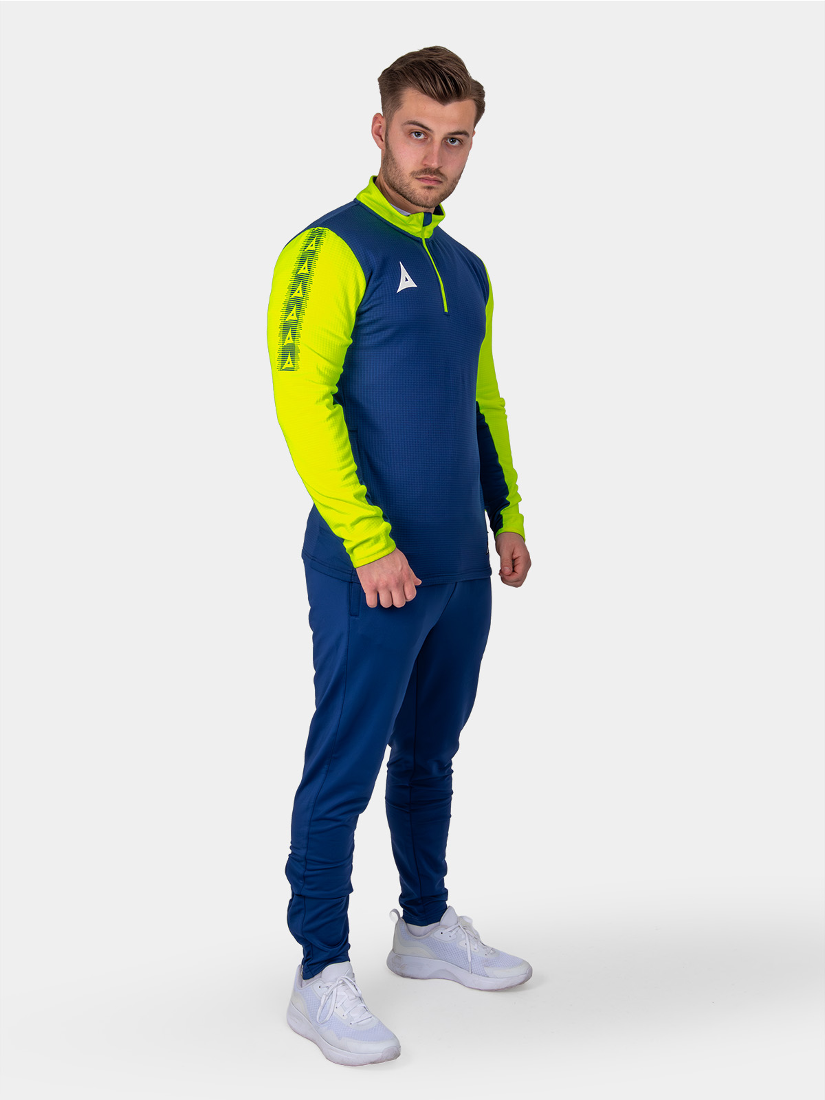 a man is wearing a navy sweat top with florescent yellow sleeves