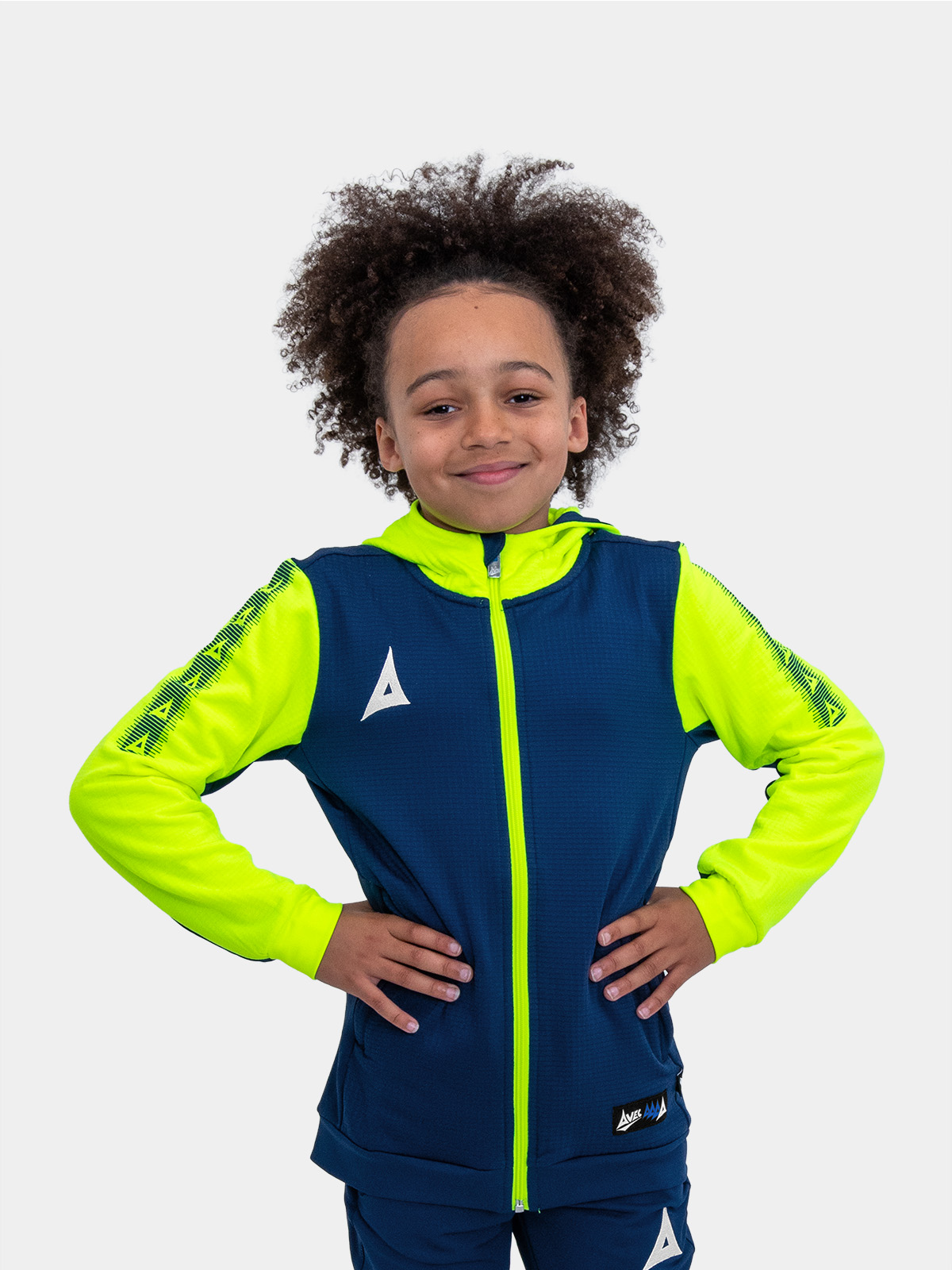 	a young boy in a vibrant neon yellow and blue hoody, radiating energy and style.