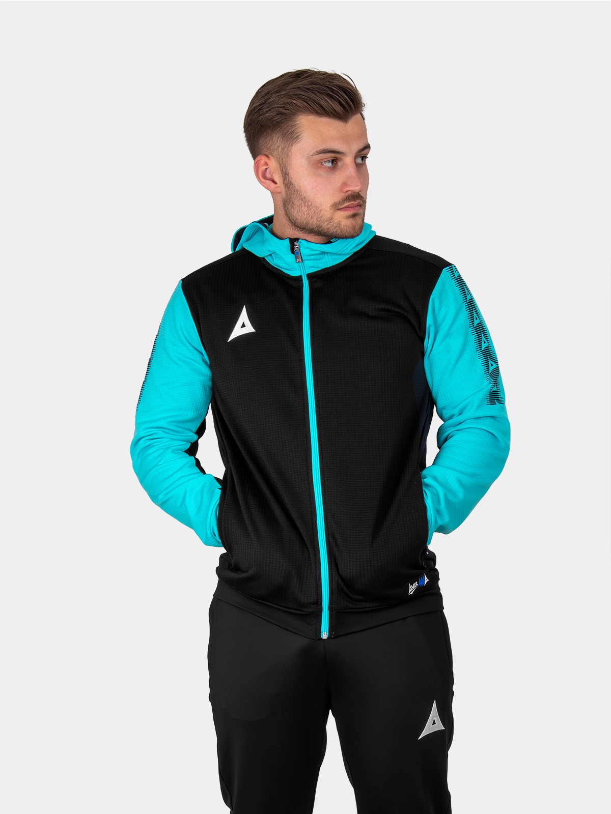 	a man is wearing a black hoodie with a full zip. the item has pale blue sleeves and zip