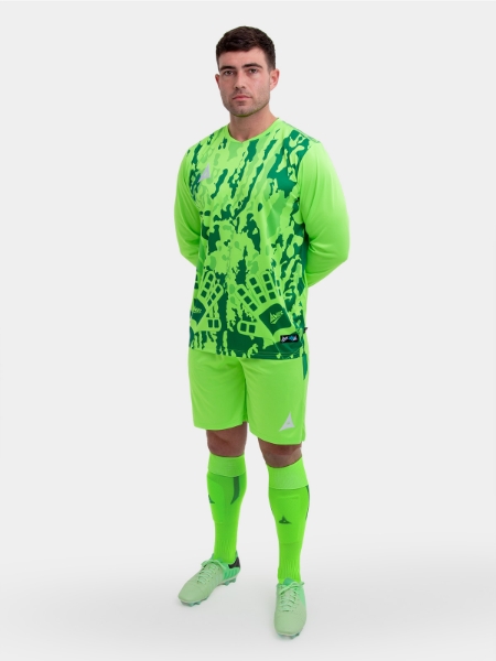 	A model is wearing a neon green goalkeeper Football Shirt. The football shirt has a camo pattern