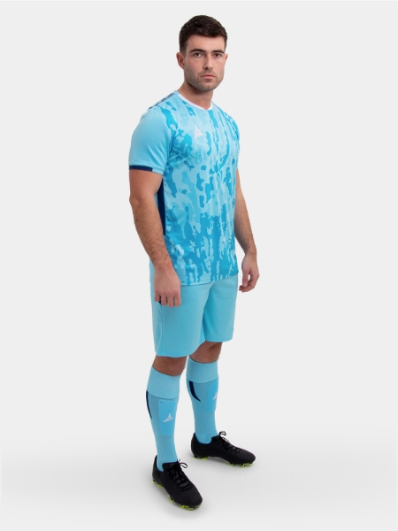 	An adult standing up wearing a sky / navy football shirt, matching Shorts and Football Socks.