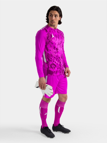 A model standing up wearing a magenta goalkeeper football shirt, magenta Shorts and magenta Football Socks.