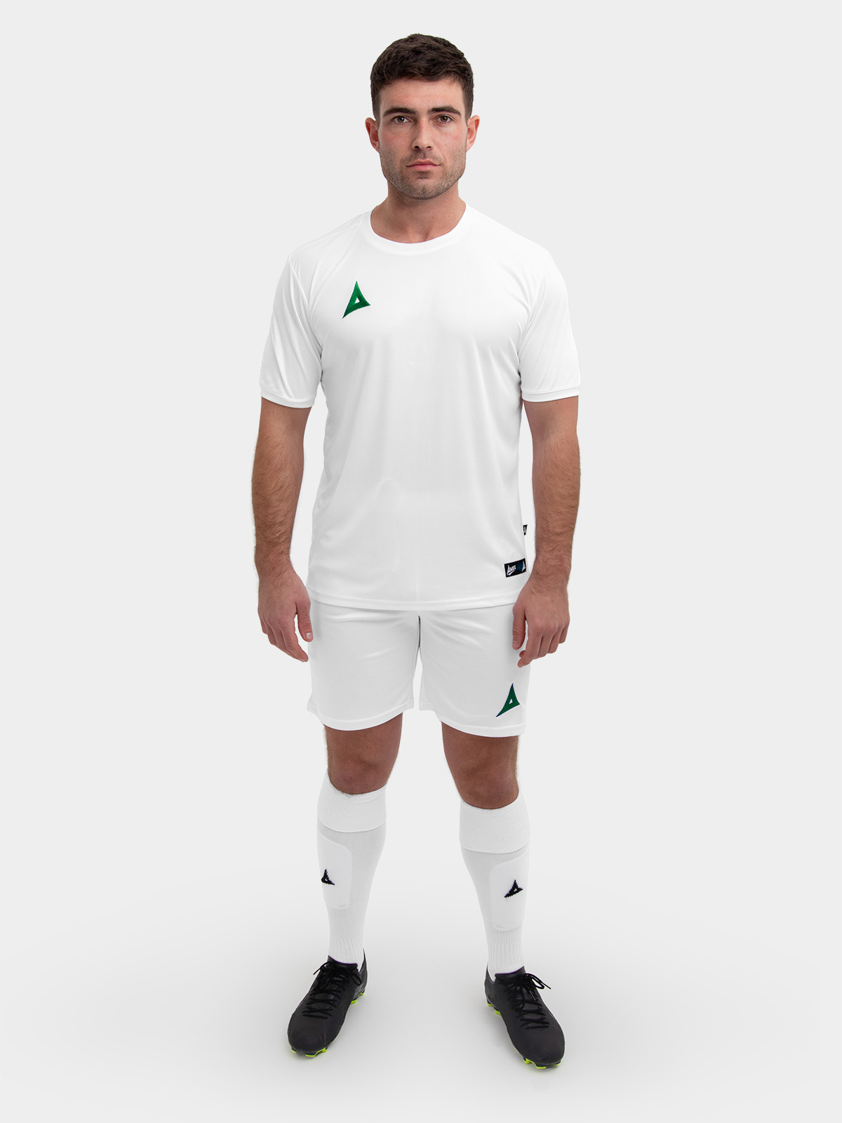 	the man in the image is wearing white shorts with a green logo