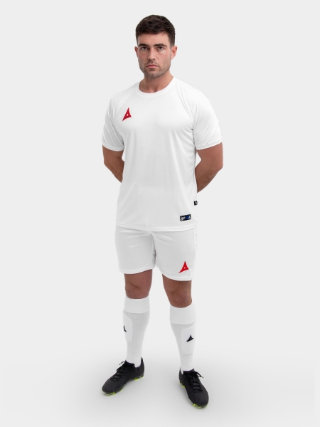 	An all white football kit with red logos