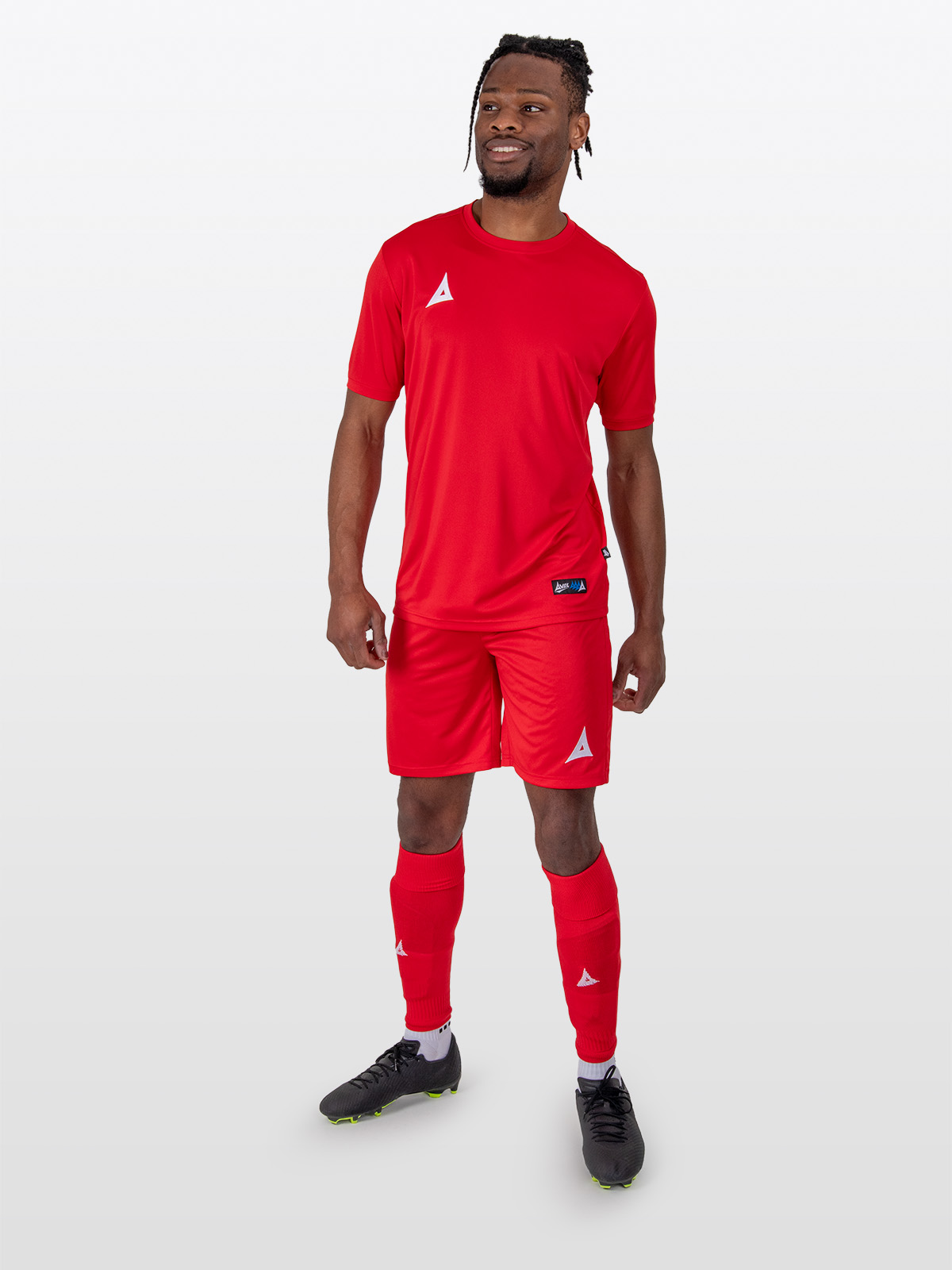 to illustrate our red football shirts a man is wearing a full red football kit