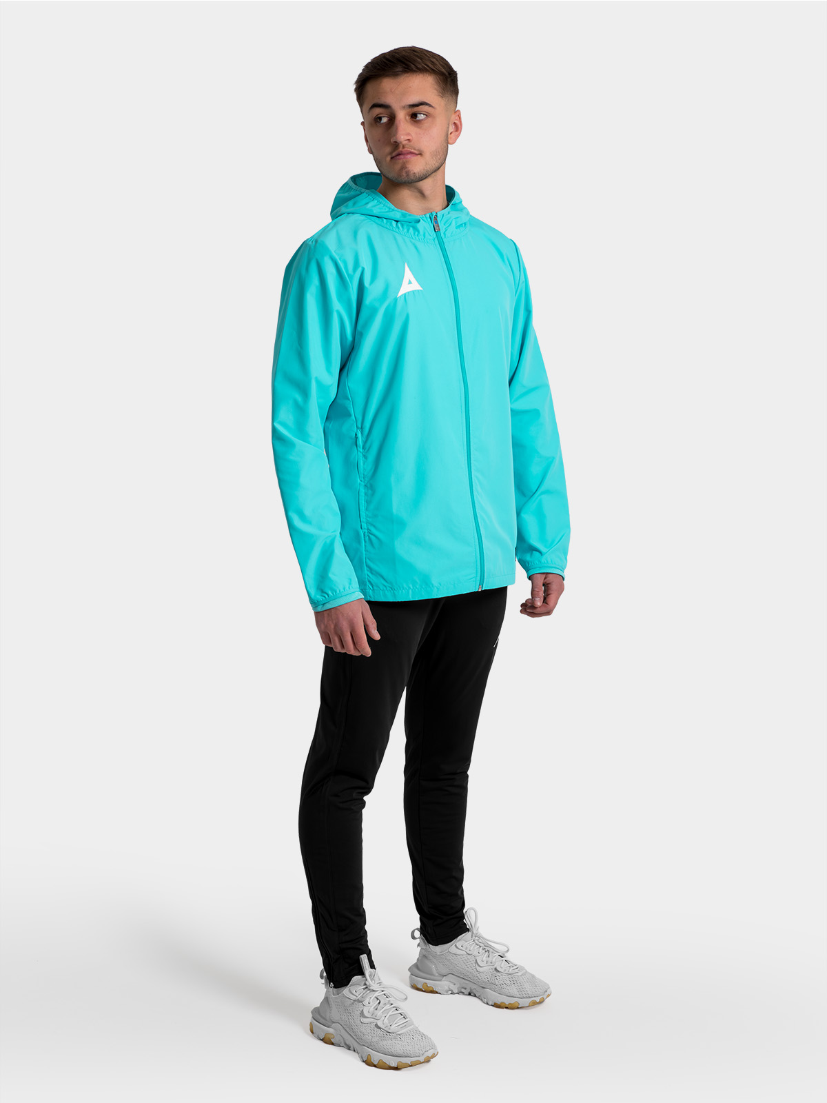 	full-body shot of the hyper blue focus 2 jacket, showing the streamlined silhouette for modern grassroots teams.