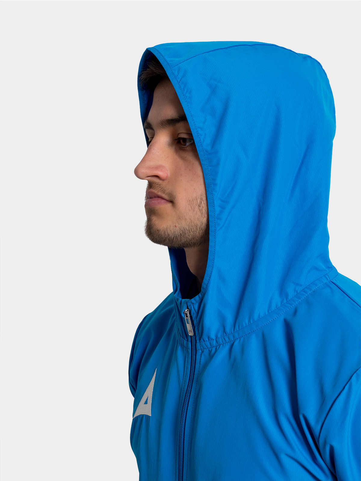	technical view of the royal blue focus 2 shell jacket hood, designed for shelter during wet-weather training sessions.