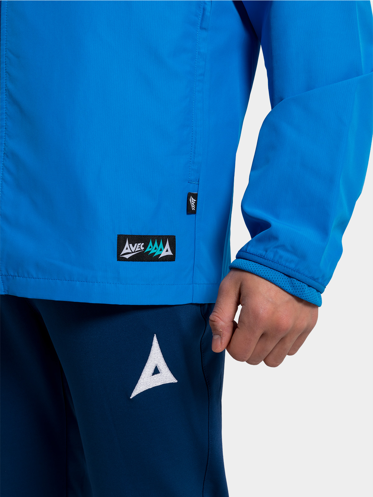 	view of the zipped side pockets on the royal blue focus 2 jacket, keeping valuables safe on the touchline