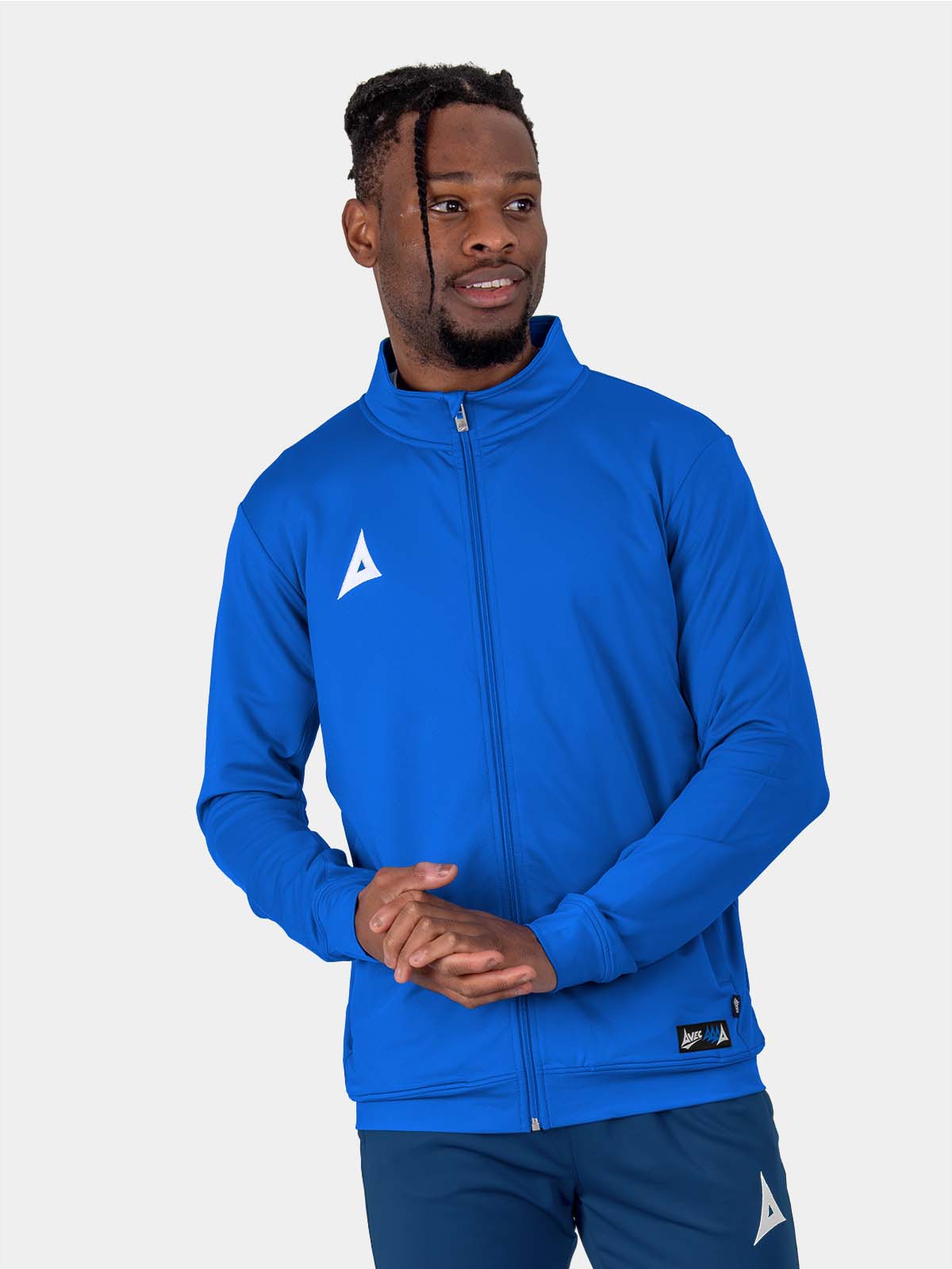 the man in the photo is wearing a plain blue polyester jacket with a full zip. the jacket has two zip pockets and a funnel neck.