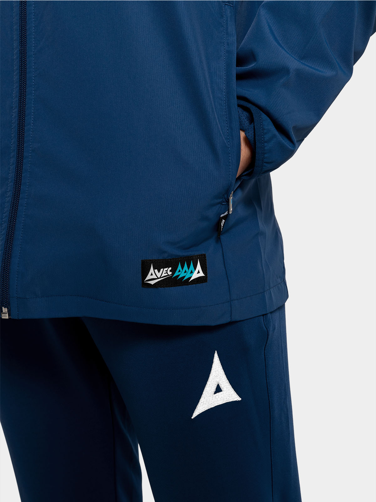 	detailed view of the zipped storage on the navy focus 2 jacket, designed for practical sideline use.