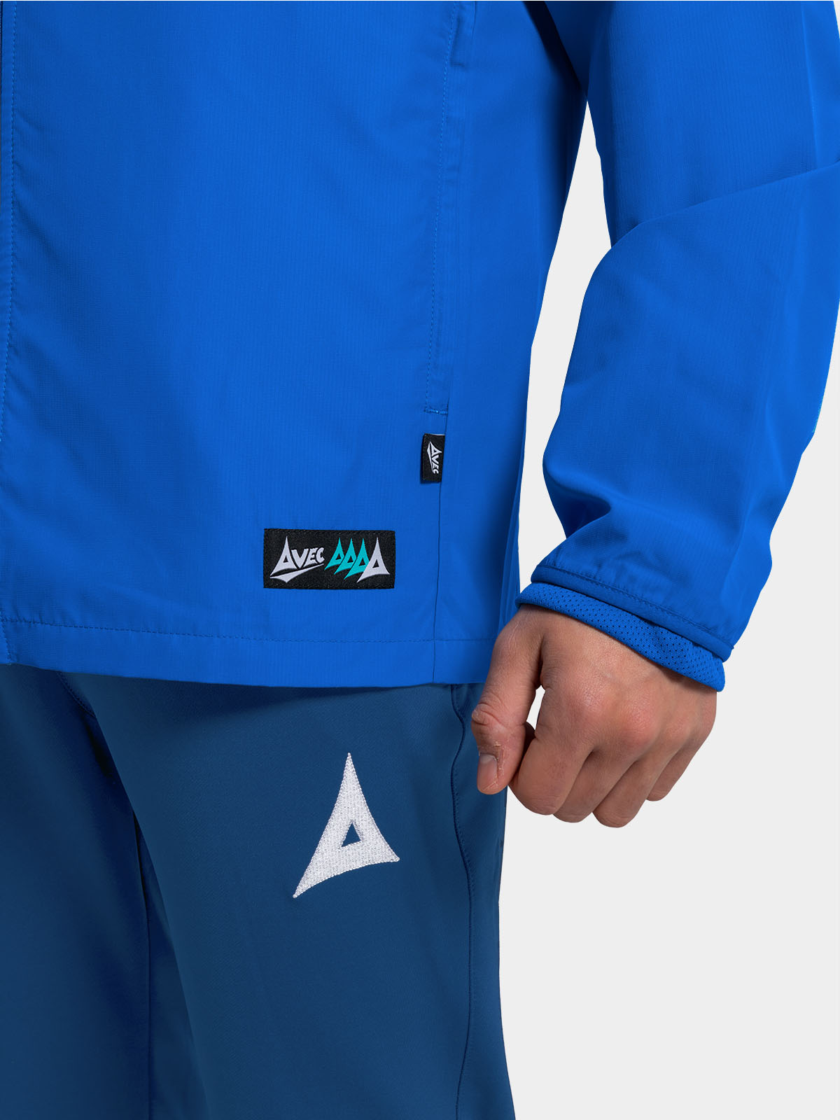 	view of the zipped side pockets on the royal blue focus 2 jacket, keeping valuables safe on the touchline