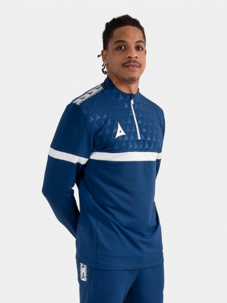 	Athlete wearing the Navy Evolve Pro Overlay, highlighting the moisture-wicking fabric and comfortable athletic collar.