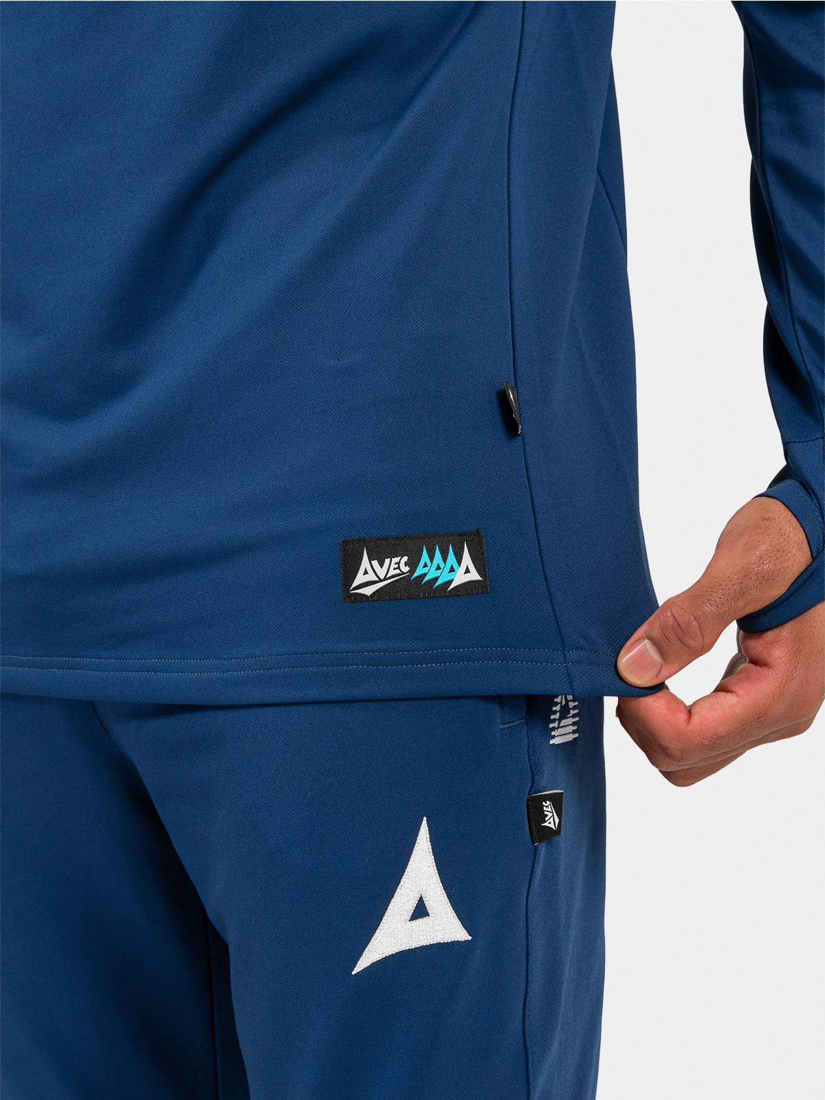 	close-up of the navy sleeve cuff featuring the integrated thumb-loop, built to prevent sleeve movement during high-intensity drills.