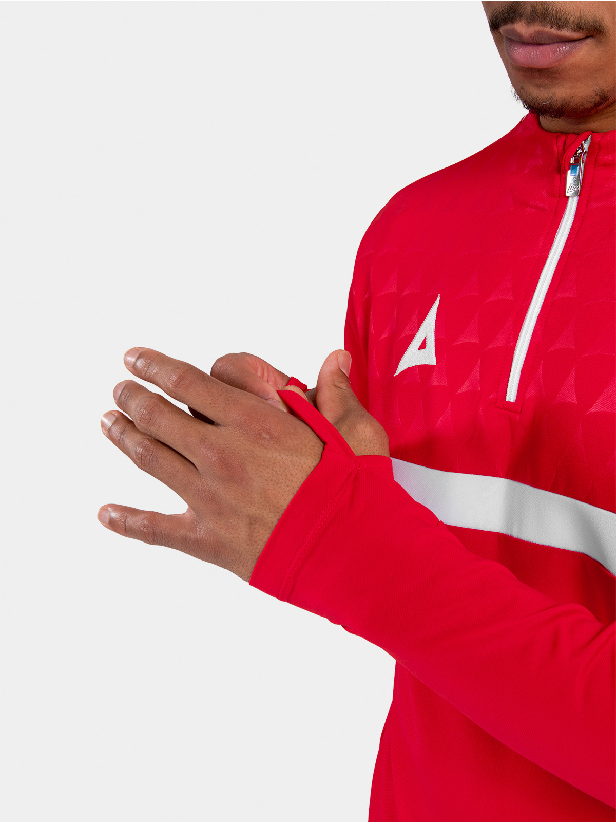 	detailed view of the red sleeve cuff featuring the integrated thumb-loop for enhanced hand coverage and fit.