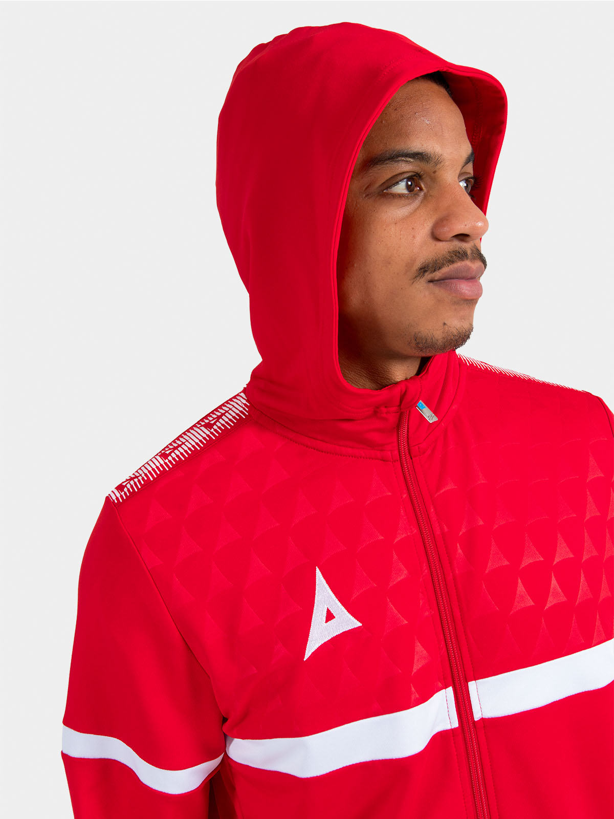 	detailed perspective of the red hood, highlighting the technical construction and comfortable microfibre lining.
