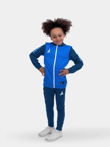 	A boy is wearing a kids hoody in blue with blue jogging bottoms