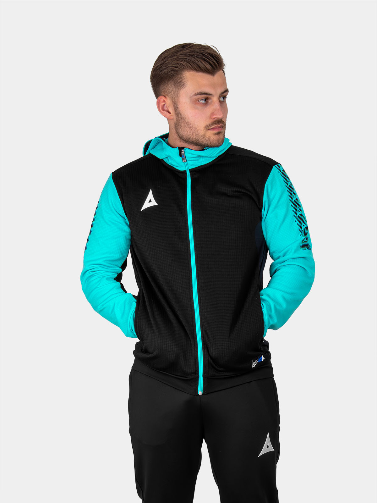 a man is wearing a black hoodie with a full zip. the item has pale blue sleeves and zip