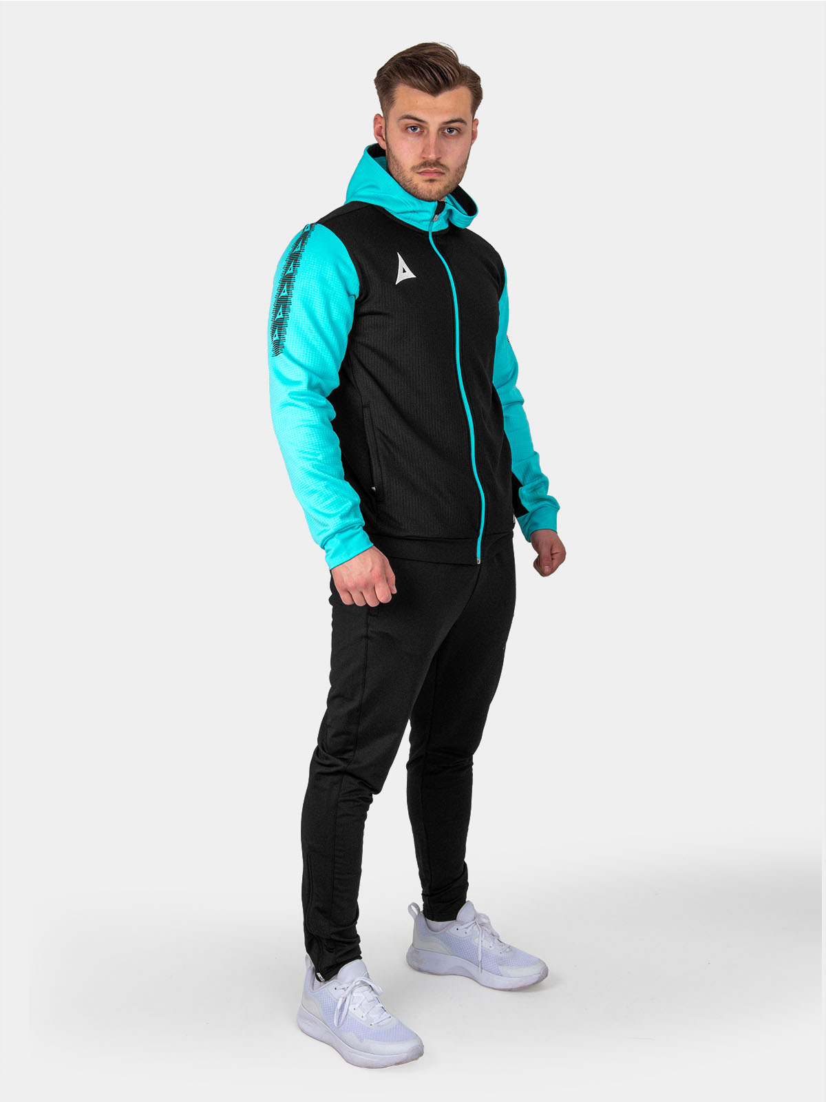 	a man is wearing a a black hoody and joggers