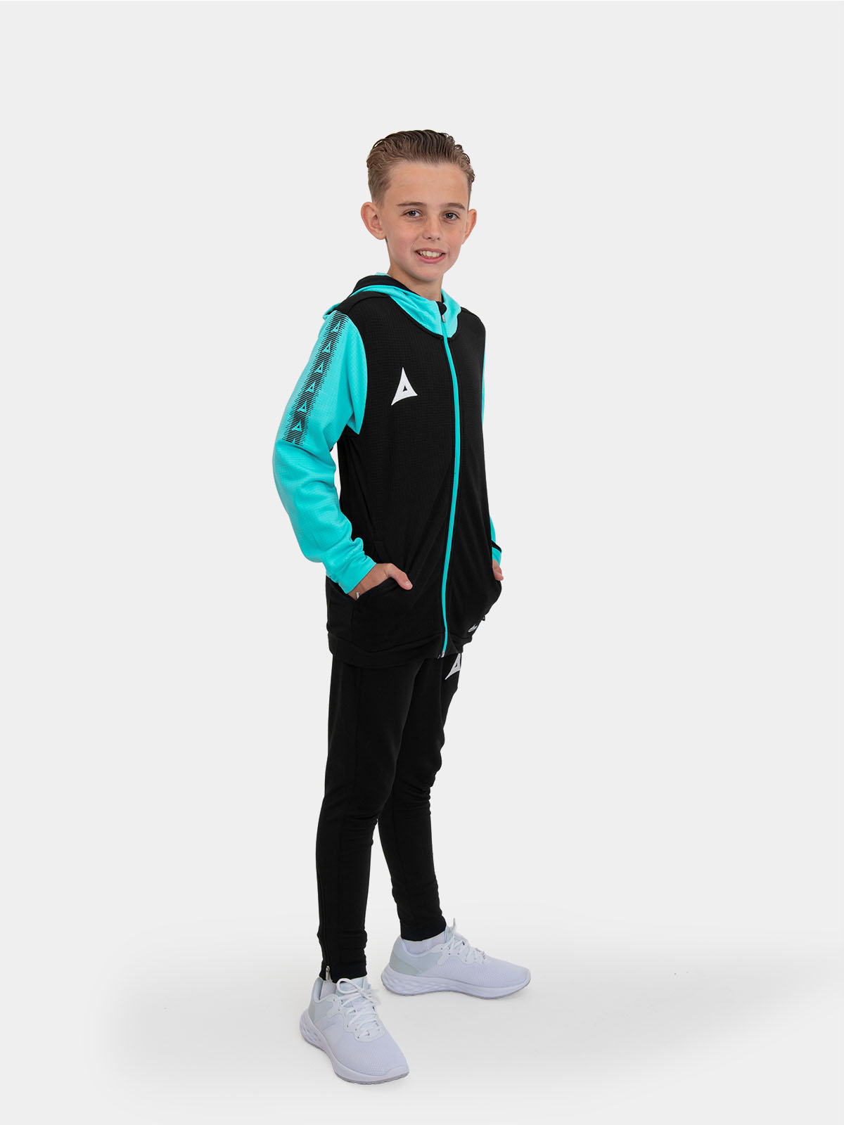 	the junior in the photograph is wearing a black hoody and black tracksuit bottoms