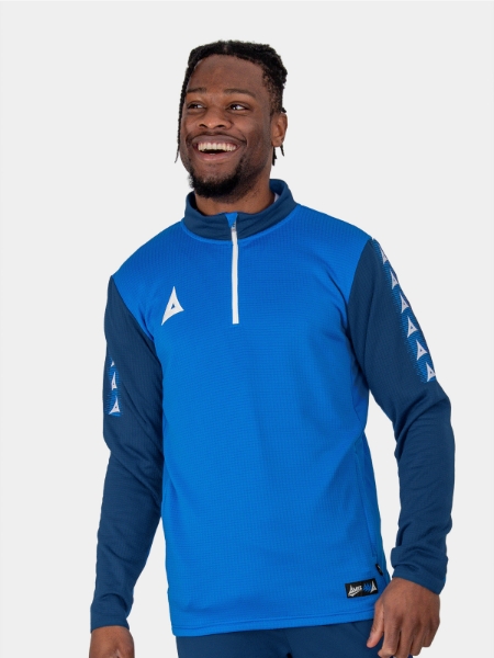 	This royal blue and navy jumper is being worn by a man. The jumper has a white quarter zip design and navy funnel neck