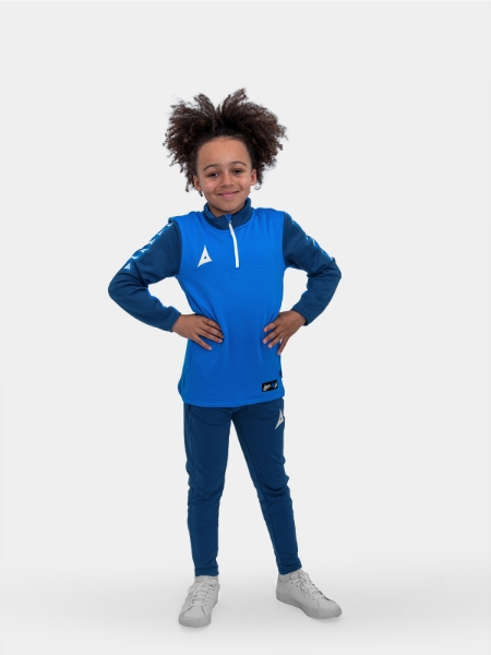 	With his hands on his hips, this young child is modelling a smart blue jumper