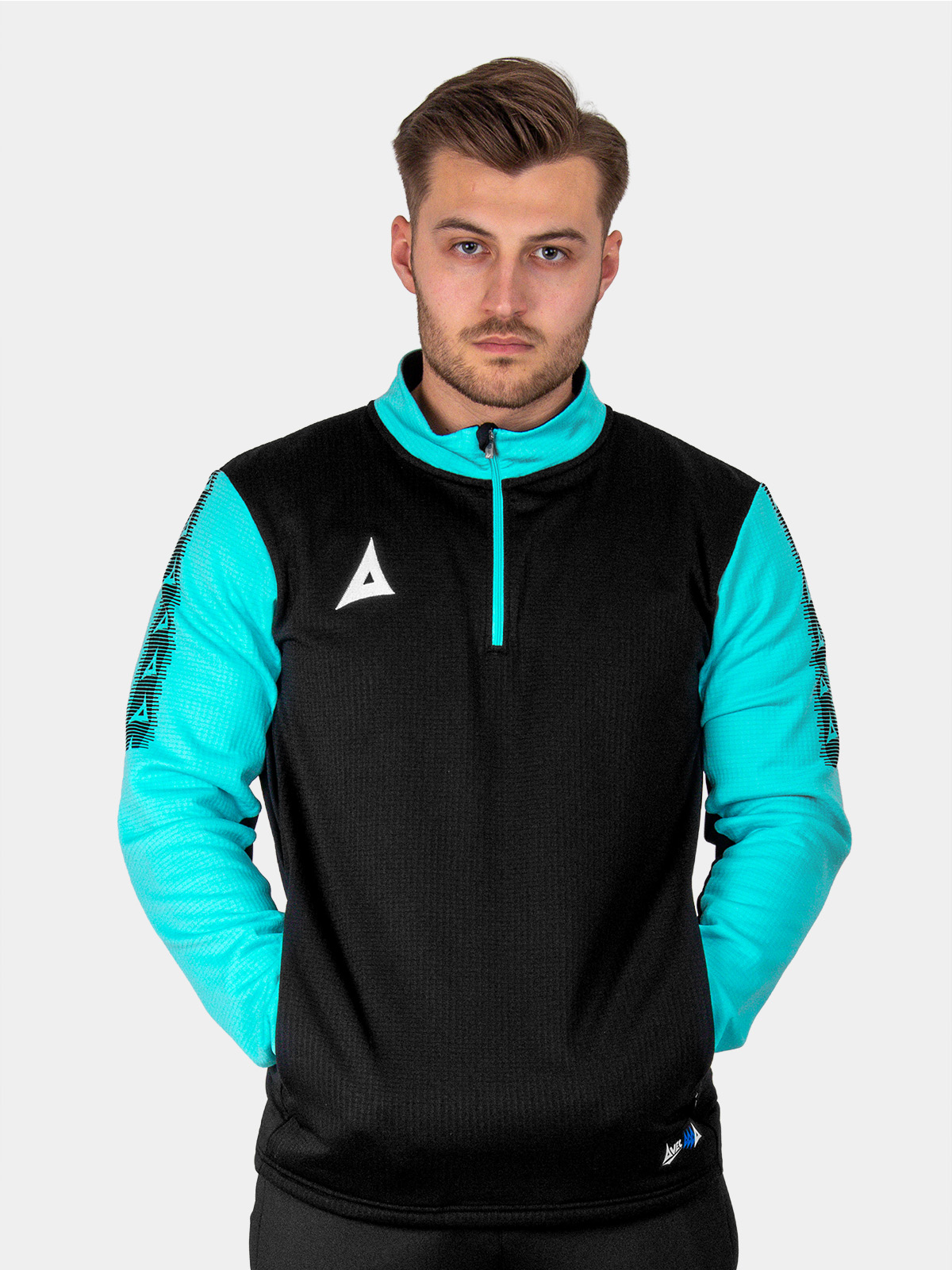 	a man is wearing a black and light blue jumper which has a quarter-zip