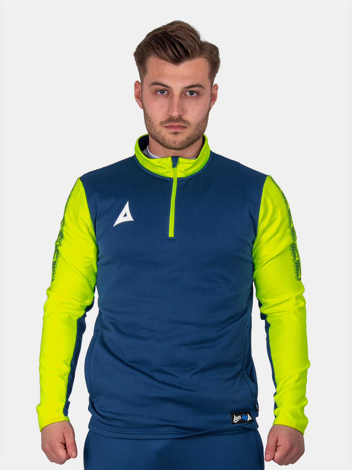	a man wearing a navy jumper with bright yellow sleeves and collar.