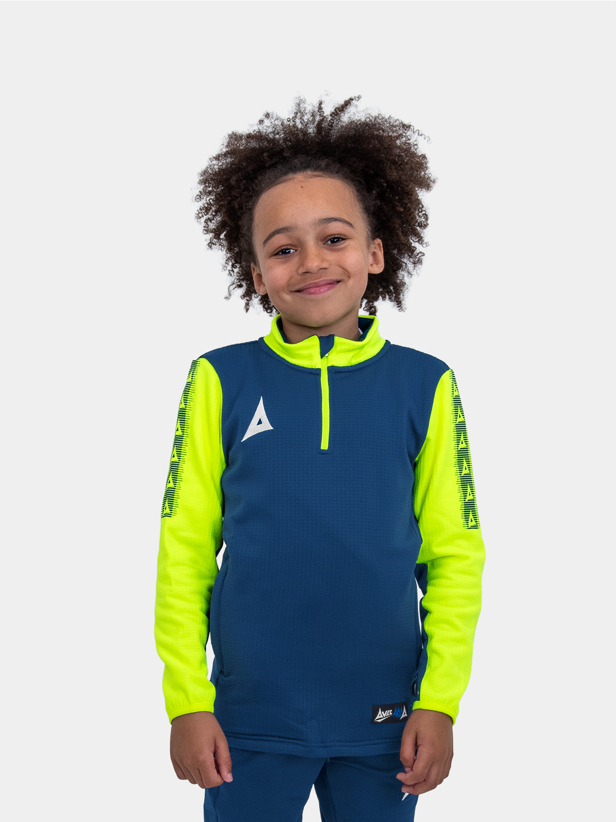 	a kids navy blue jumper with yellow sleeves makes this young boy stand out from the crowd.