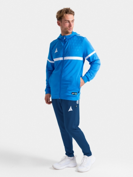 Athlete posing in the Navy Evolve Pro Tech Pant, demonstrating the blend of elite performance and modern style