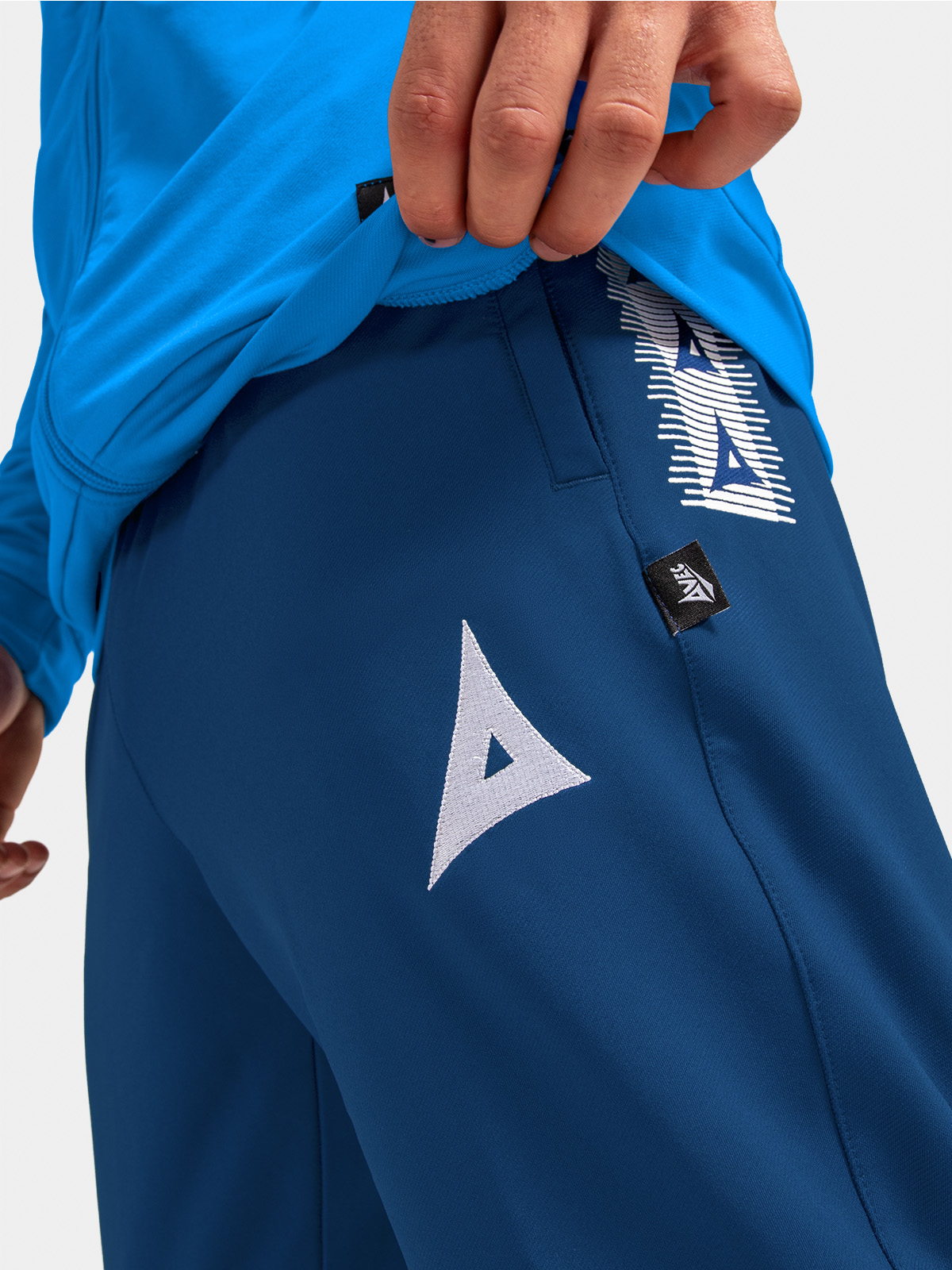 	close-up of the navy technical quick-dry fabric, highlighting the breathable weave and durable performance construction.