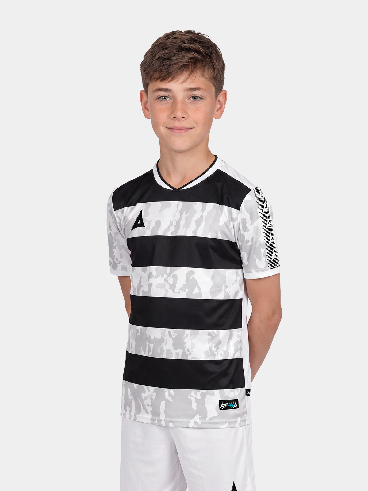 	junior boy wearing the black and white pro intent hoop jersey, showcasing the professional pro-fit and athletic silhouette