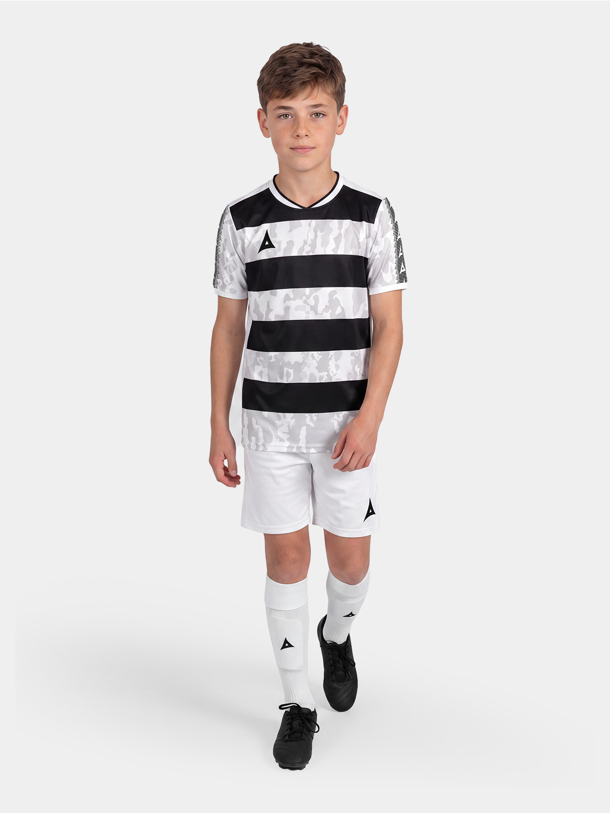 full body kit view of the black and white pro intent jersey, styled with matching teamwear shorts and socks.