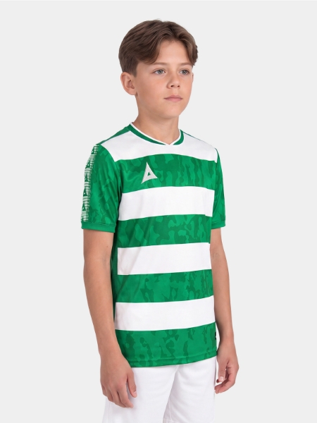 	Studio portrait shot of a boy wearing the Green and White Pro Intent Jersey, focusing on the comfortable athletic fit.