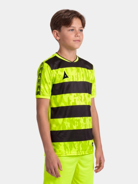 Young boy wearing the Neon Yellow and Black Pro Intent Jersey, highlighting the bold, high-energy matchday style.