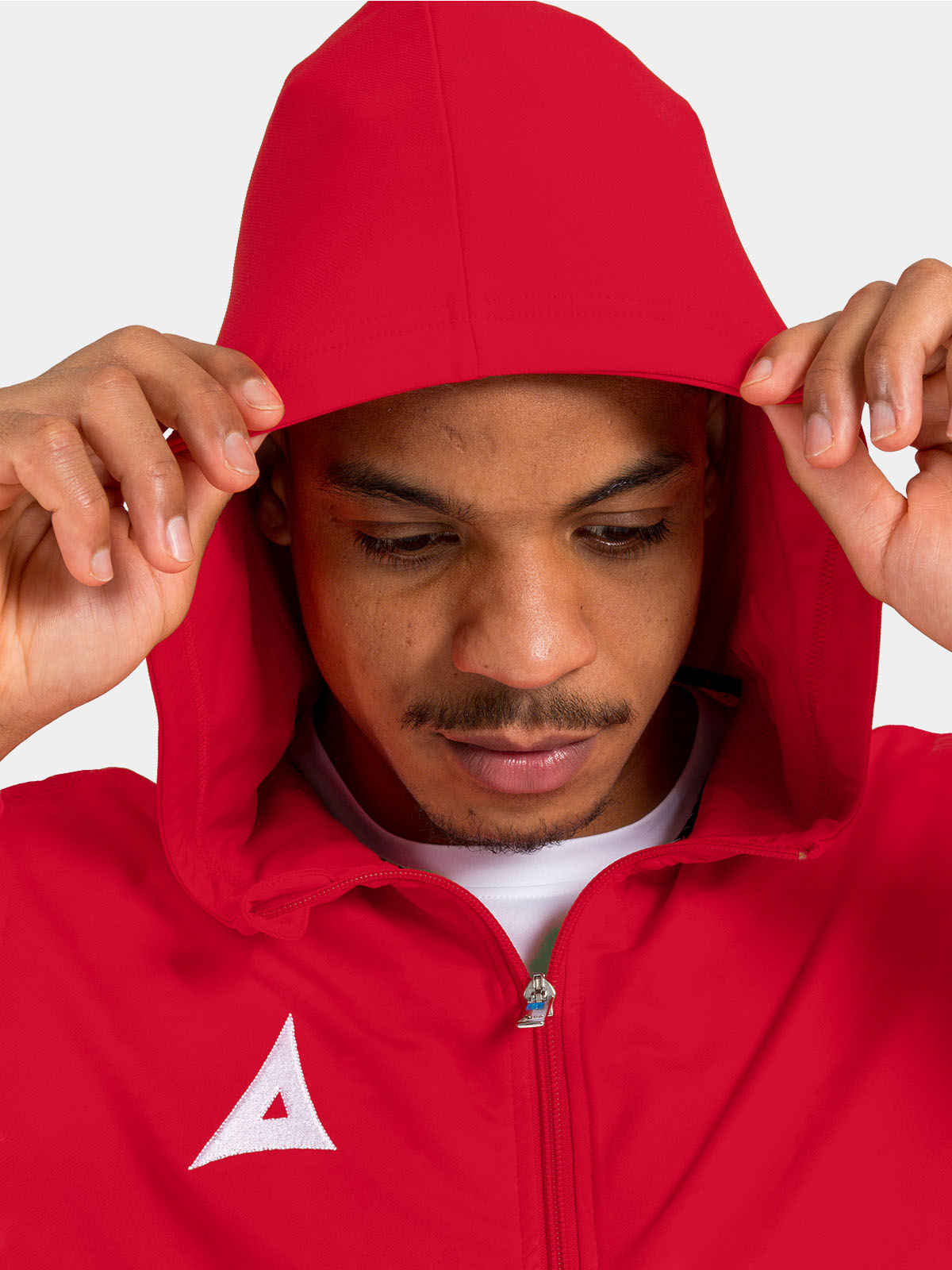 	detailed view of the red technical hood, built for warmth and breathability on the training pitch