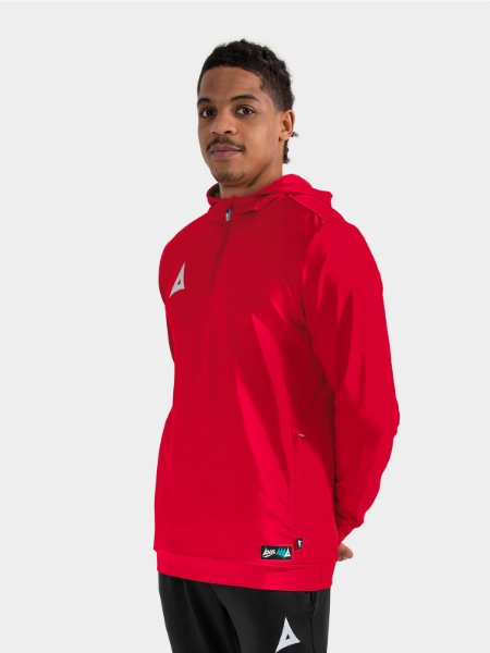 	Model showcasing the Red Focus 2 QZ Hoody, illustrating the ergonomic fit for high-intensity movement.