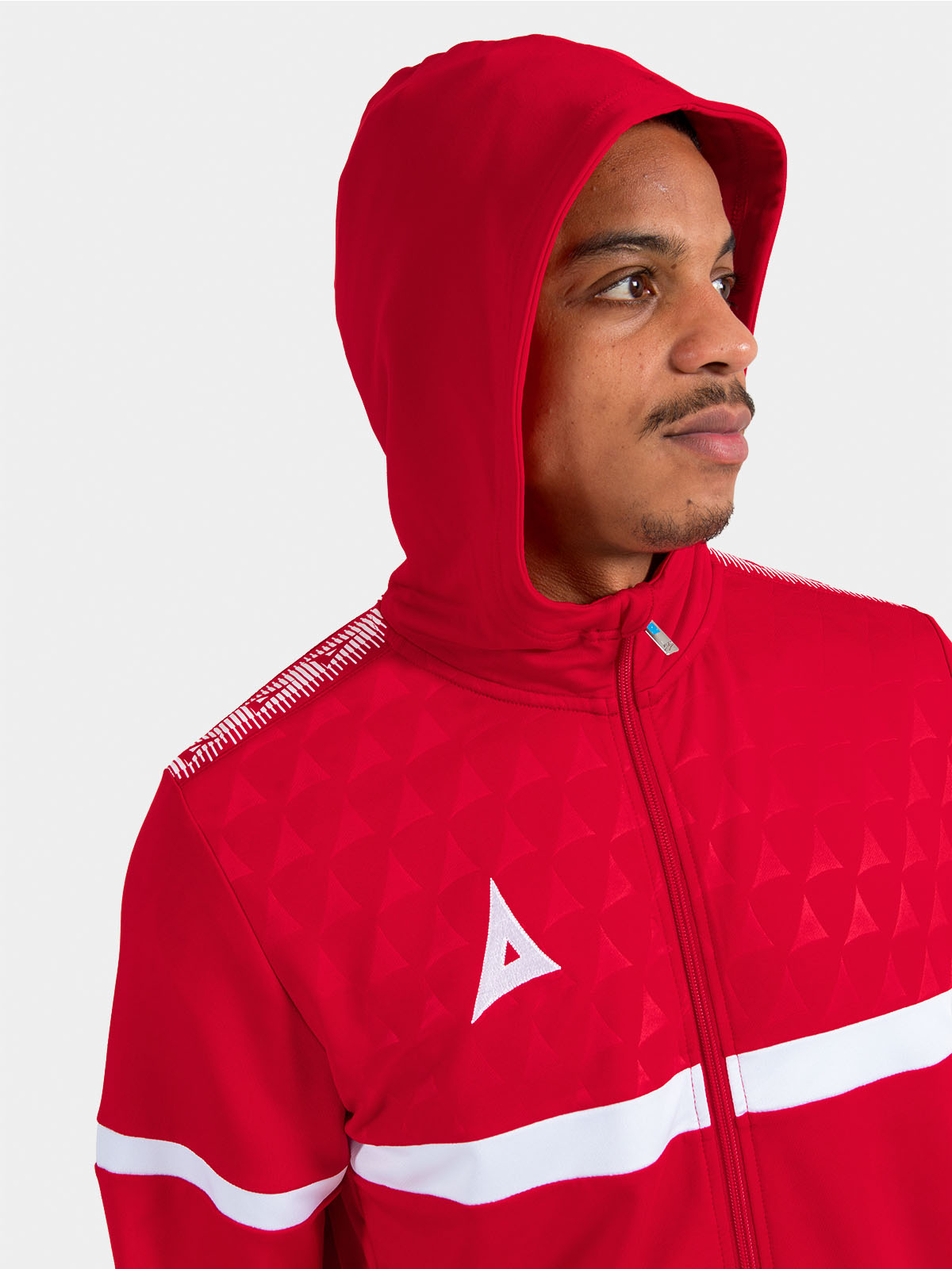 	detailed perspective of the red hood, highlighting the technical construction and comfortable microfibre lining.