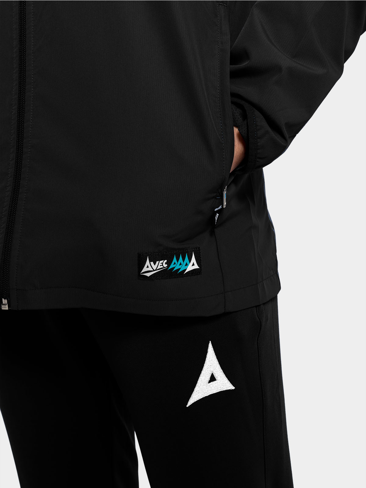 	detailed view of the zipped storage on the black focus 2 jacket, designed for practical sideline use.