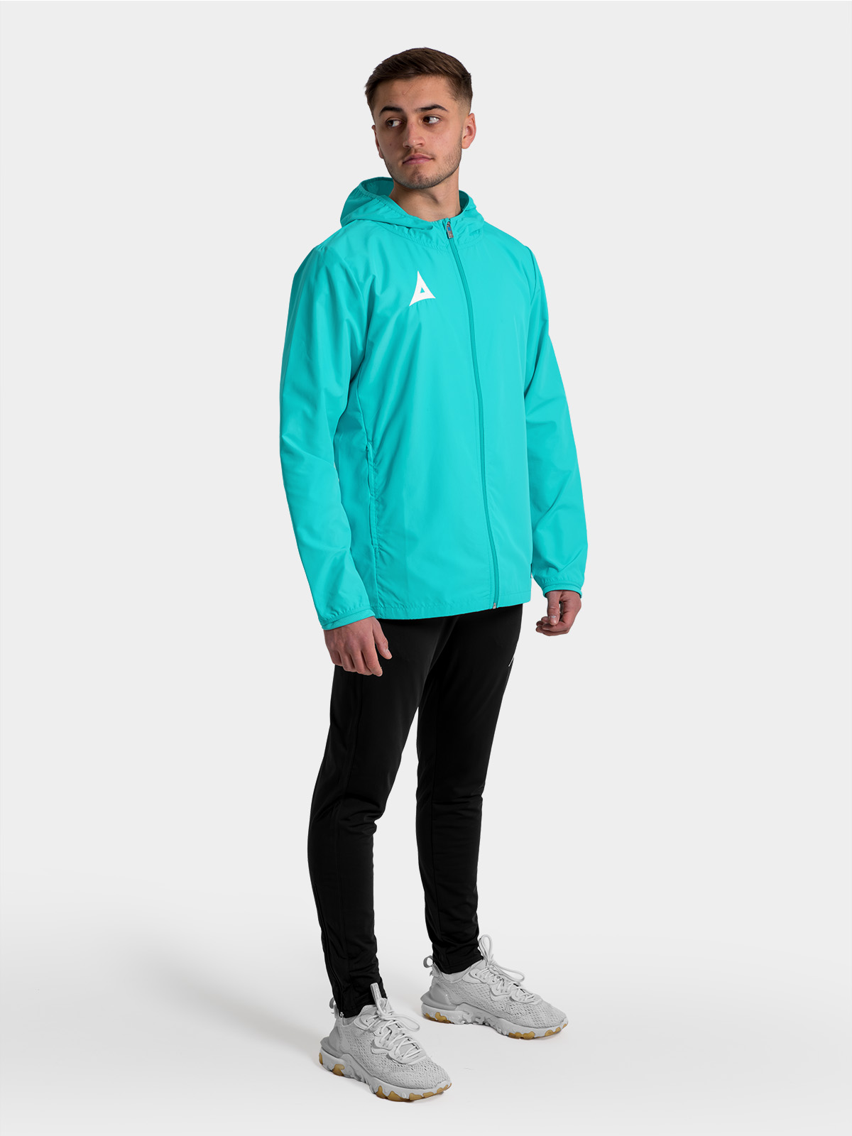 	full-body shot of the hyper blue focus 2 jacket, showing the streamlined silhouette for modern grassroots teams.